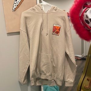 Tan hoodie with red and orange grand canyon on front and back men’s size S